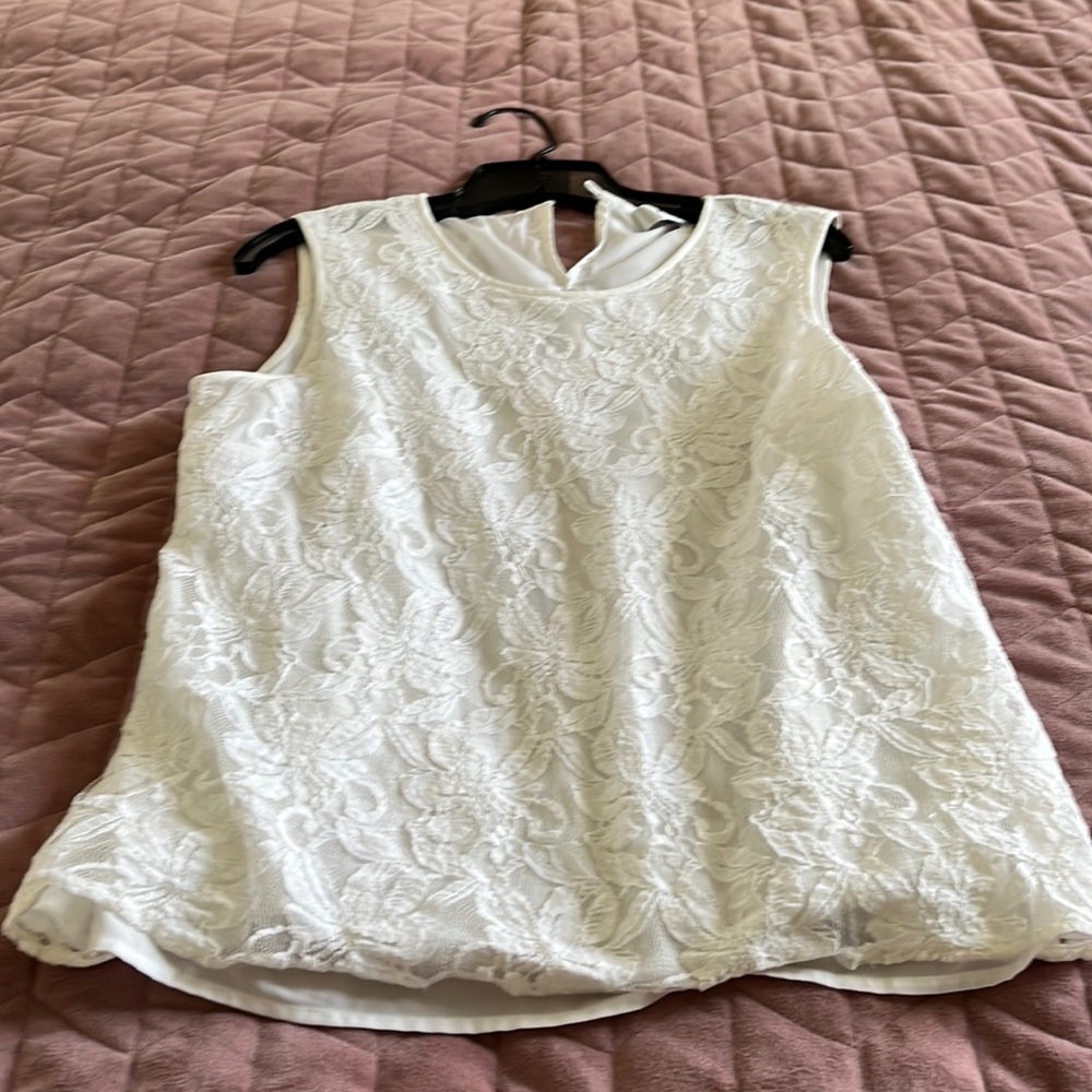 White lacy top over white material, size large. Very pretty & versatile.